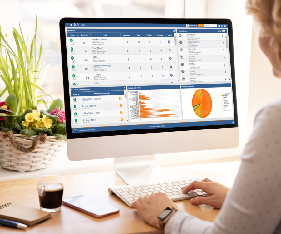 Image depicting a woman viewing the Frontier Software applicant portal, part of the Recruitment Management module, on an apple iMac.