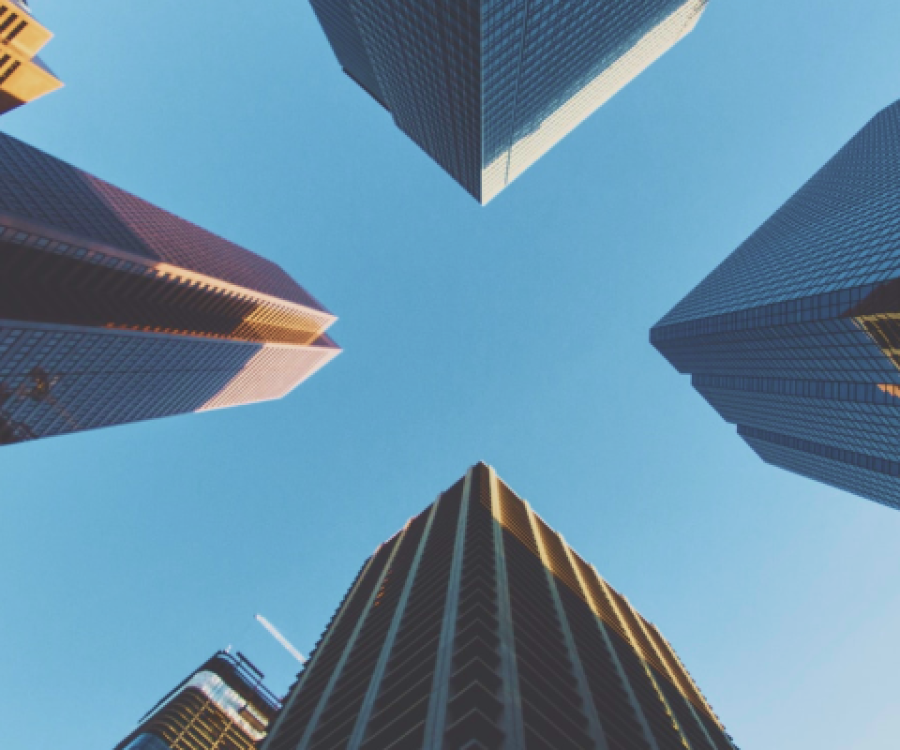 Image looking up at skyscrapers from ground