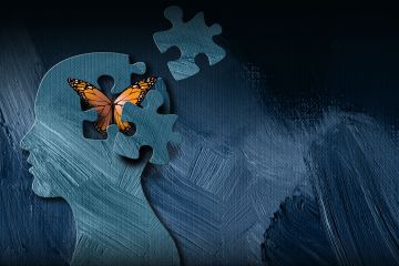 The image shows a silhouette of a human head with a puzzle piece missing, replaced by a butterfly.