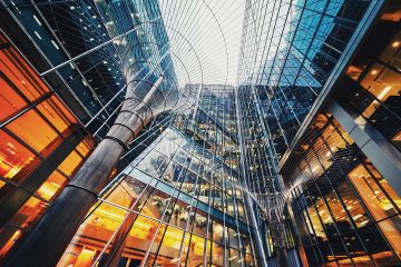 A towering urban landscape with glass skyscrapers and intricate details. The image captures a sense of grandeur and sophistication.